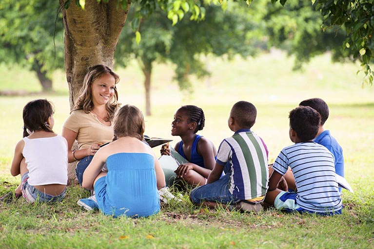 Montessori 4 Inclusion Children Sitting Around Tree
