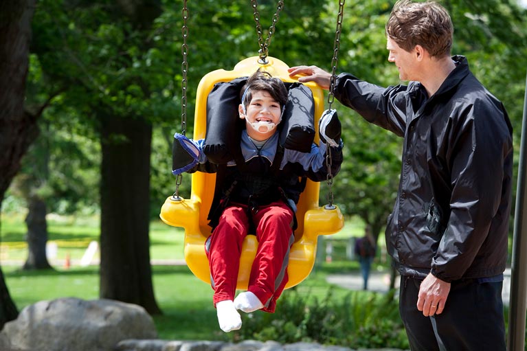 About - Special Needs Child in Swing