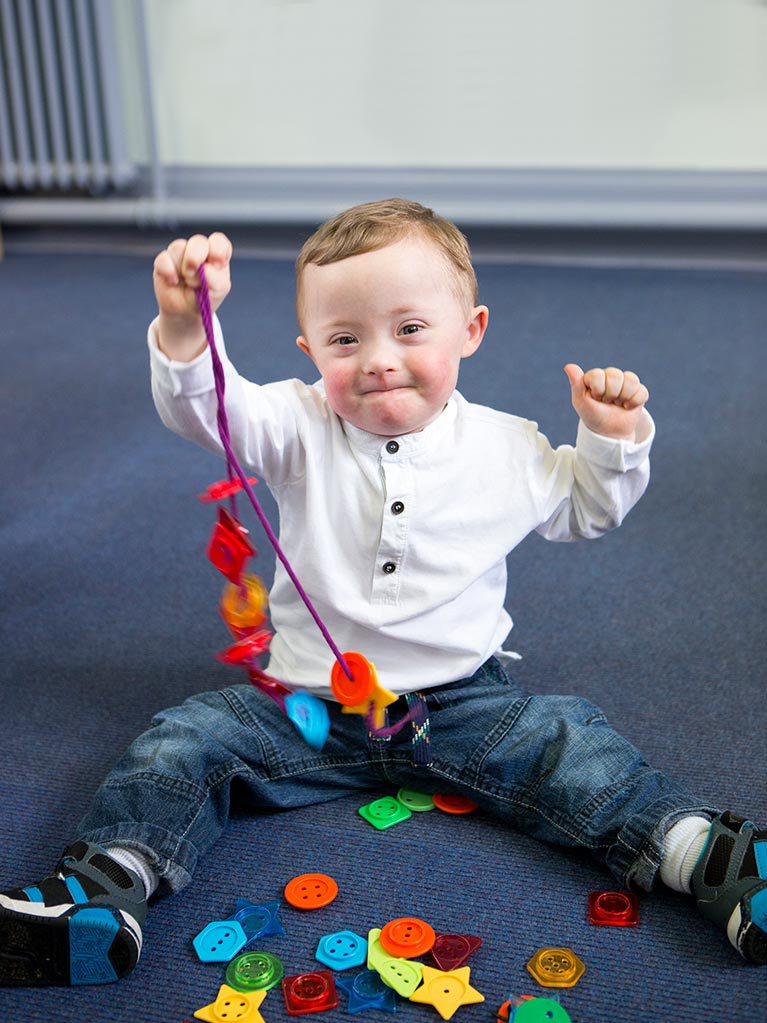 Contact Us - Image of a Baby playing